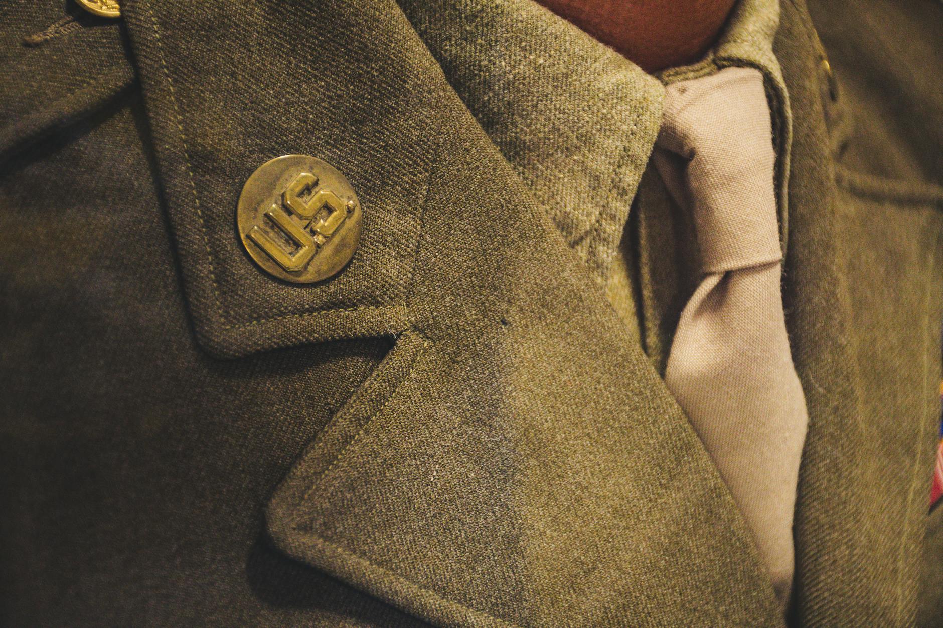 brown notched lapel suit jacket close up photo